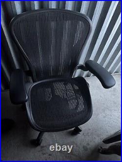 Aeron Adjustable swirling office chair by Herman Miller