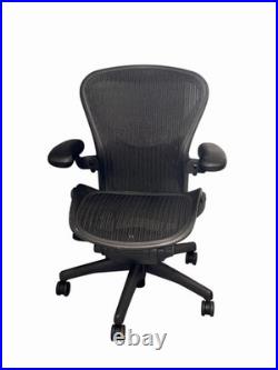 Herman Miller Aeron Black Office Chair With Pellicle Mesh And Fixed Vinyl Arms