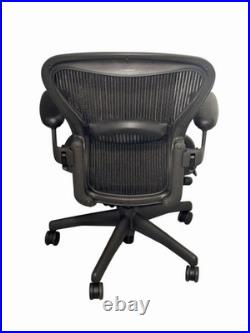 Herman Miller Aeron Black Office Chair With Pellicle Mesh And Fixed Vinyl Arms