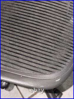 Herman Miller Aeron Black Office Chair With Pellicle Mesh And Fixed Vinyl Arms